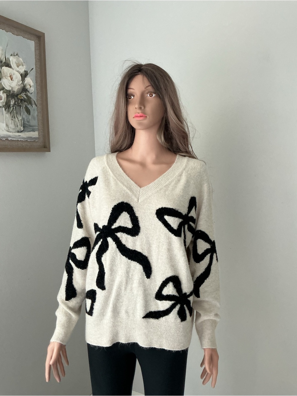 Express Cream V-Neck Sweater with Black Bow Accents